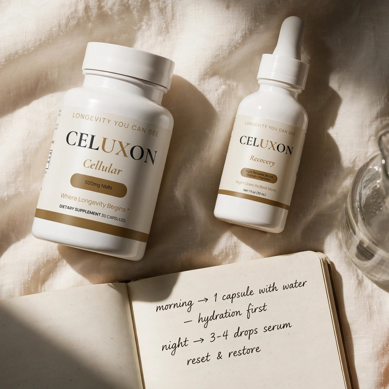 Two white CELUXON Cellular dropper and supplement bottles arranged on a textured beige fabric surface with a glass of water, an open notebook with handwritten notes, and a small succulent plant.